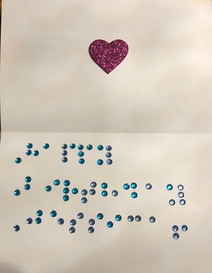 glittery, tactile, heart sticker and raised gems that spell out Happy Birthday in Braille