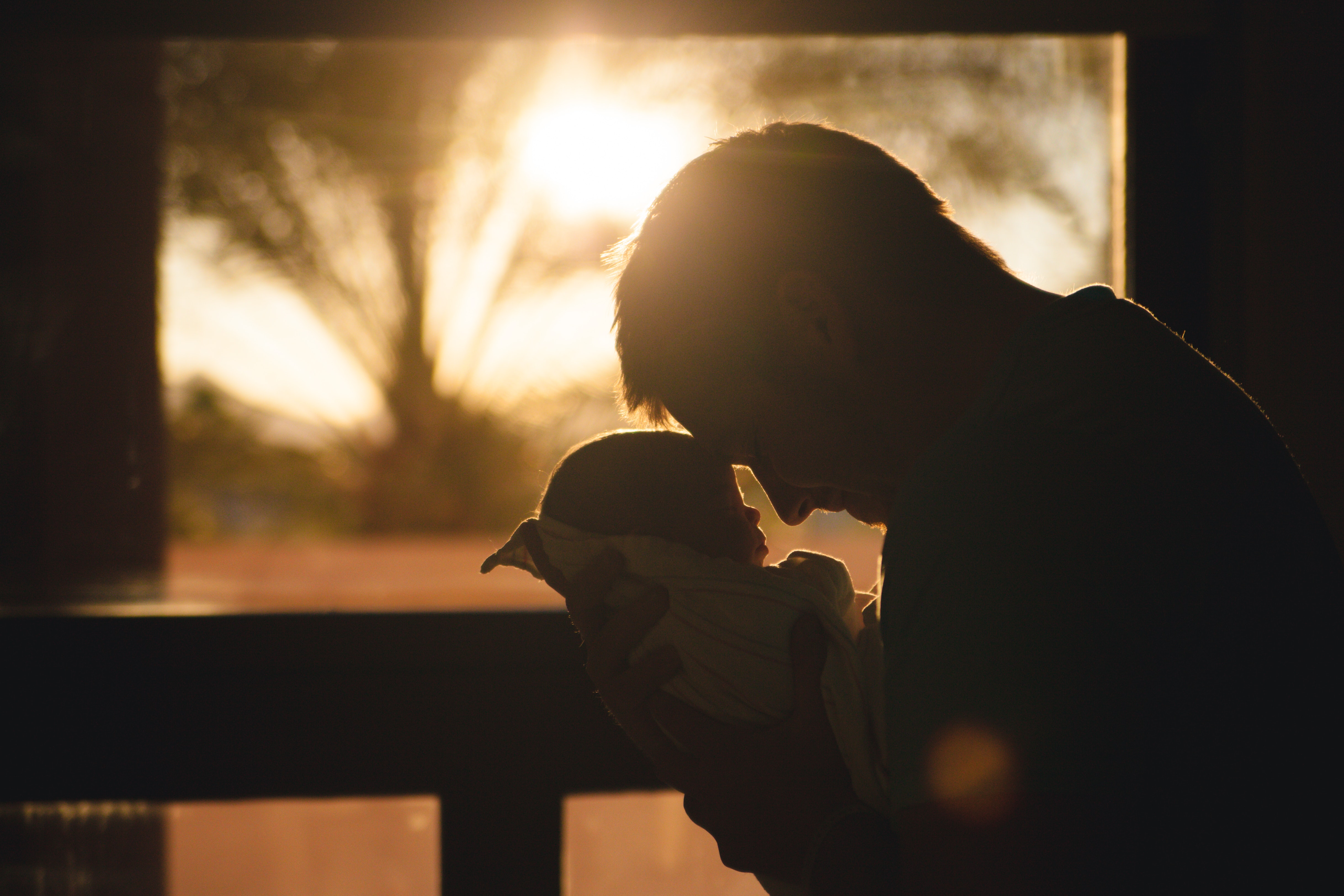 Man holding a newborn baby