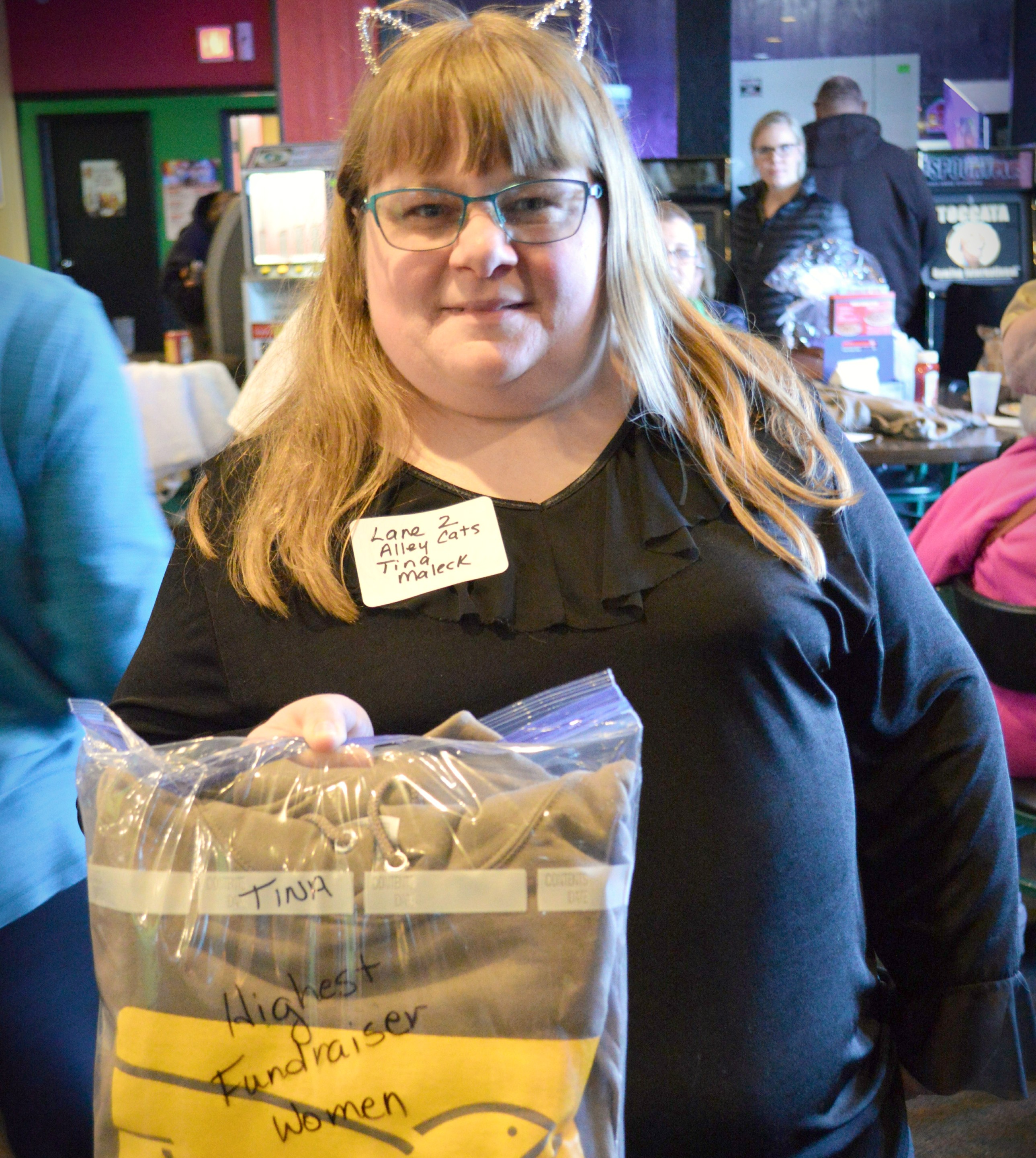 Girl holding bag that shows her as top fundraiser