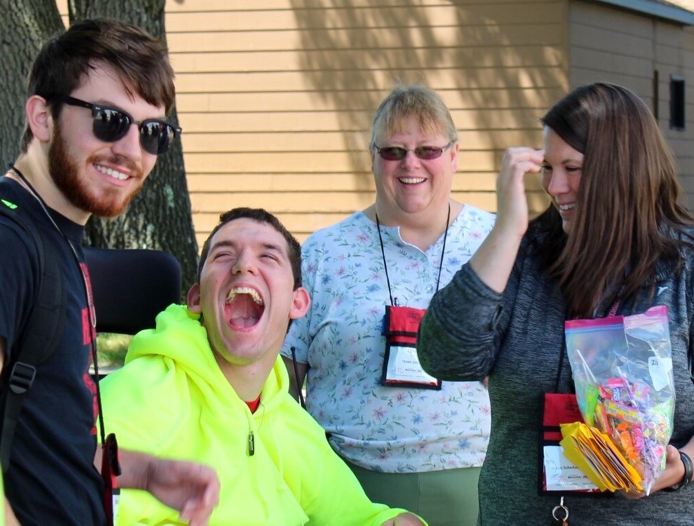 A group of people laughing and having fun